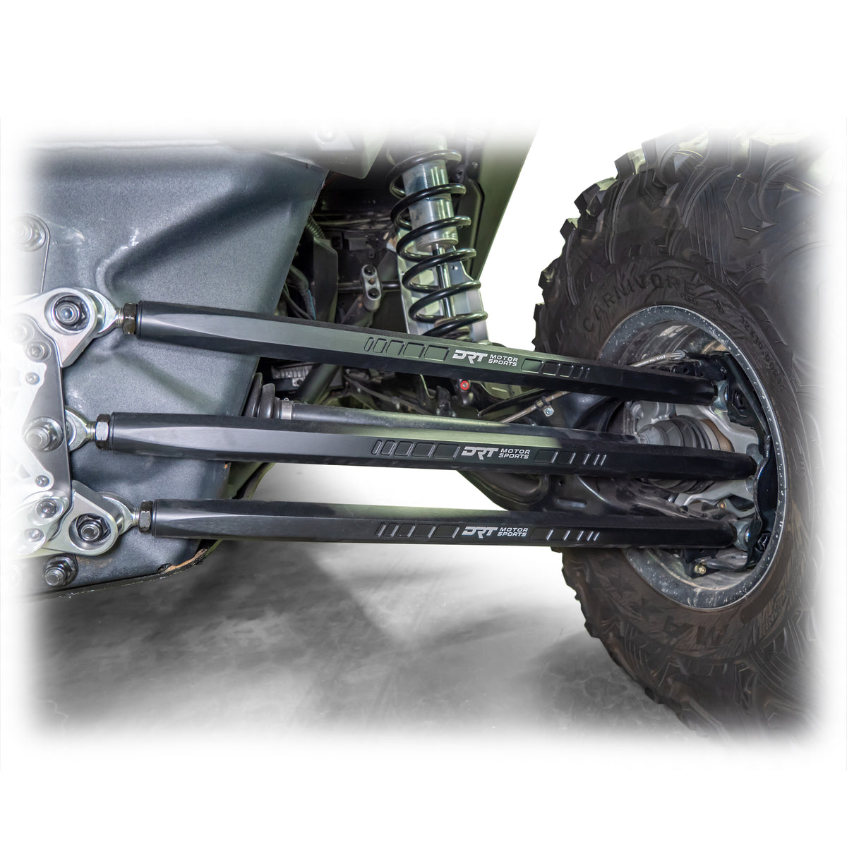 Installed barrel radius rod kit under rear control arm of Maverick X3