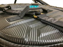 Load image into Gallery viewer, Spare tire storage bag sitting inside inverted off road wheel