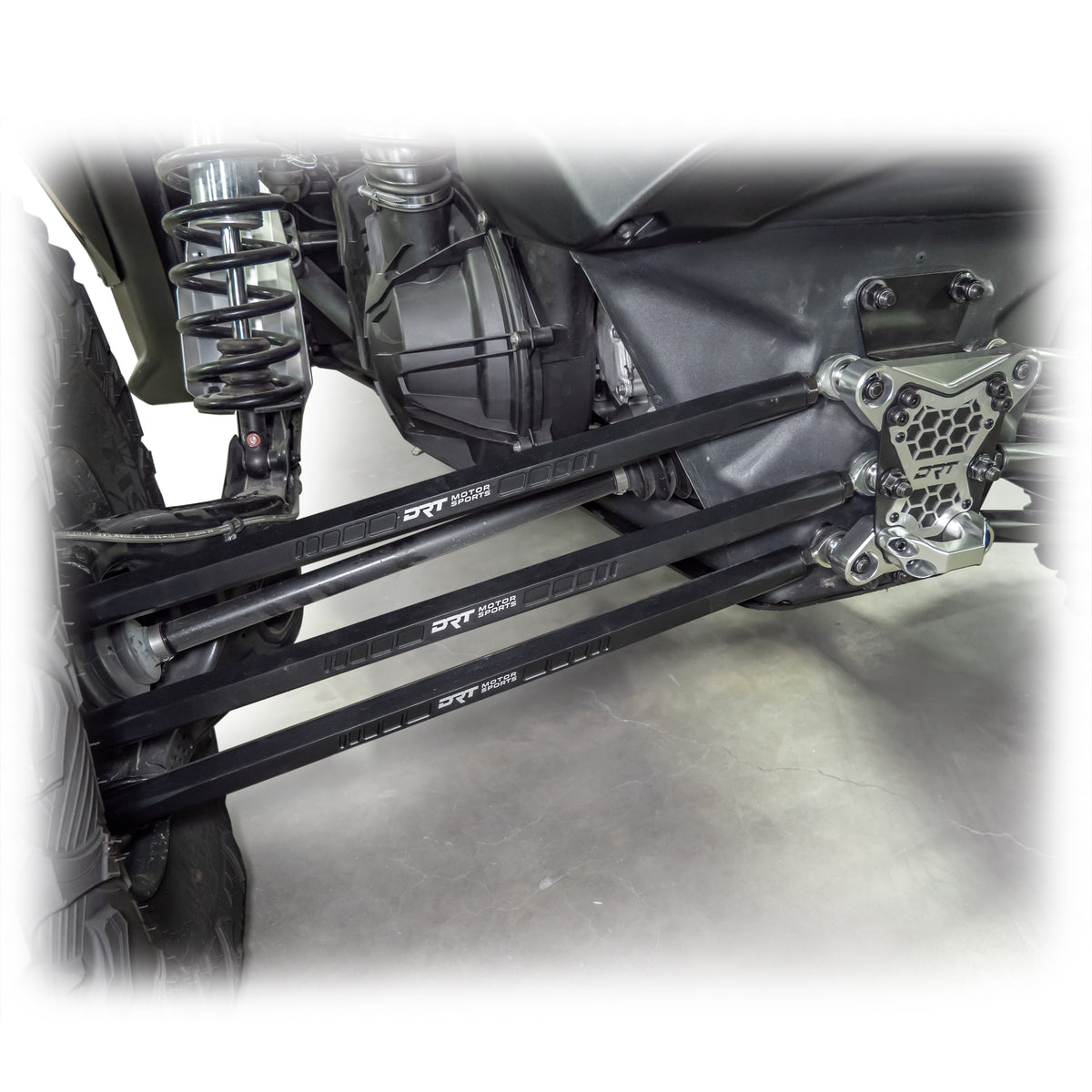 Ground clearance snapshot with billet radius rod kit beneath X3 rear end